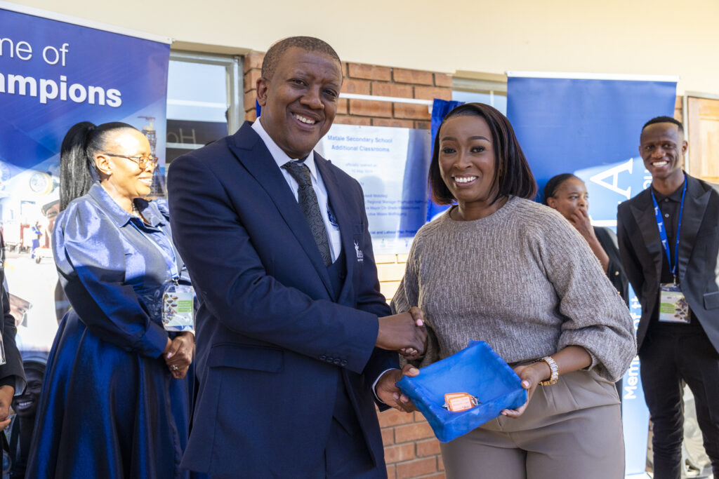 Moses Motlhageng, Chief Executive of Impala Rustenburg with Koketso Bogopane from Matlafatso Investment, an Impala Enterprise and Suppler Development (ESD) Programme beneficiary and contractor for the Matale Secondary School SLP project.